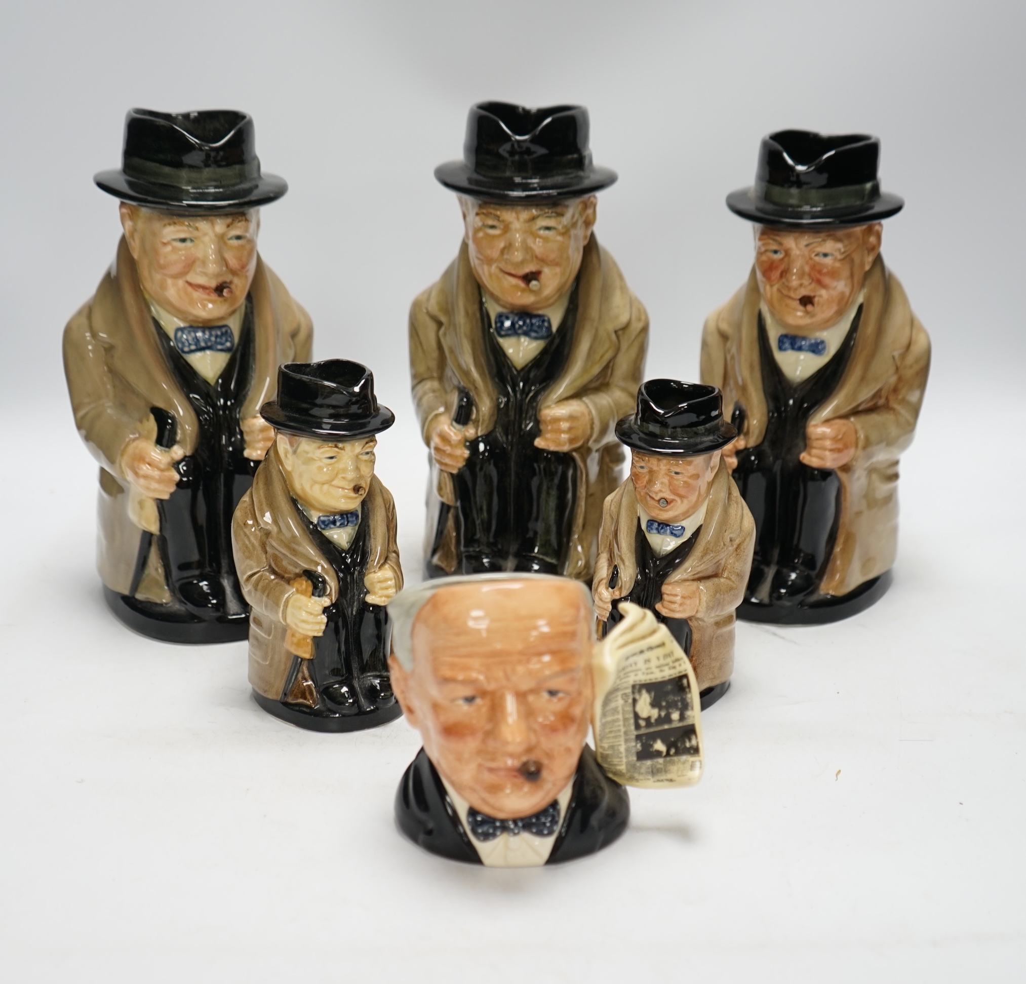 A group of six Doulton Winston Churchill character jugs, largest 23cm high. Condition - good, some crazing